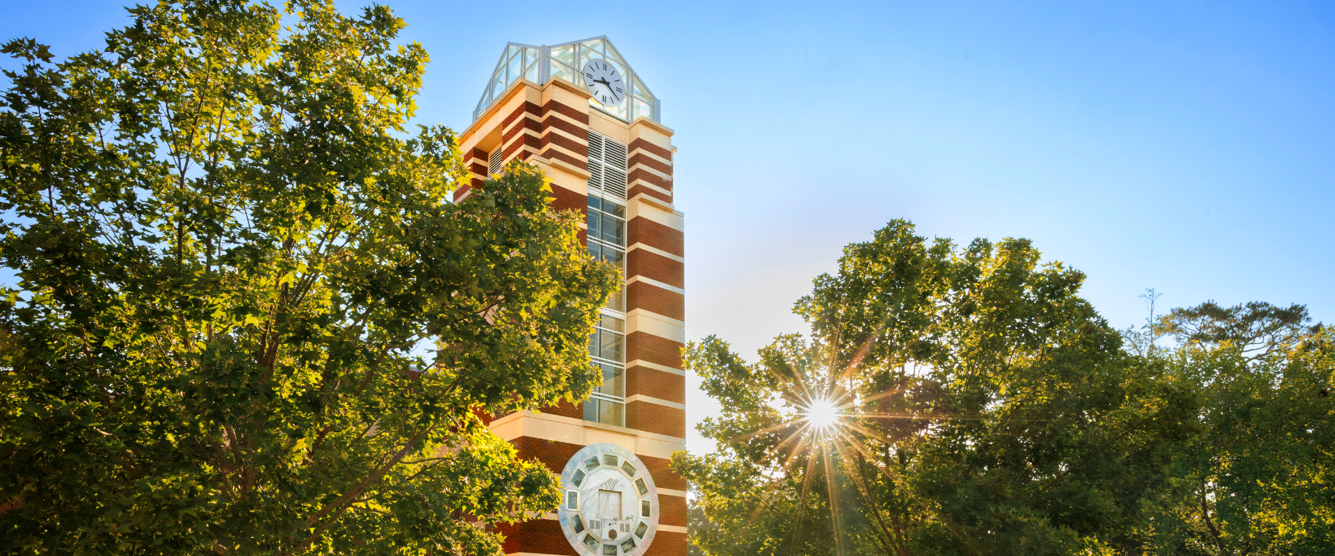 A tall, brick tower displaying a clock that serves as a landmark on ECU's campus.
